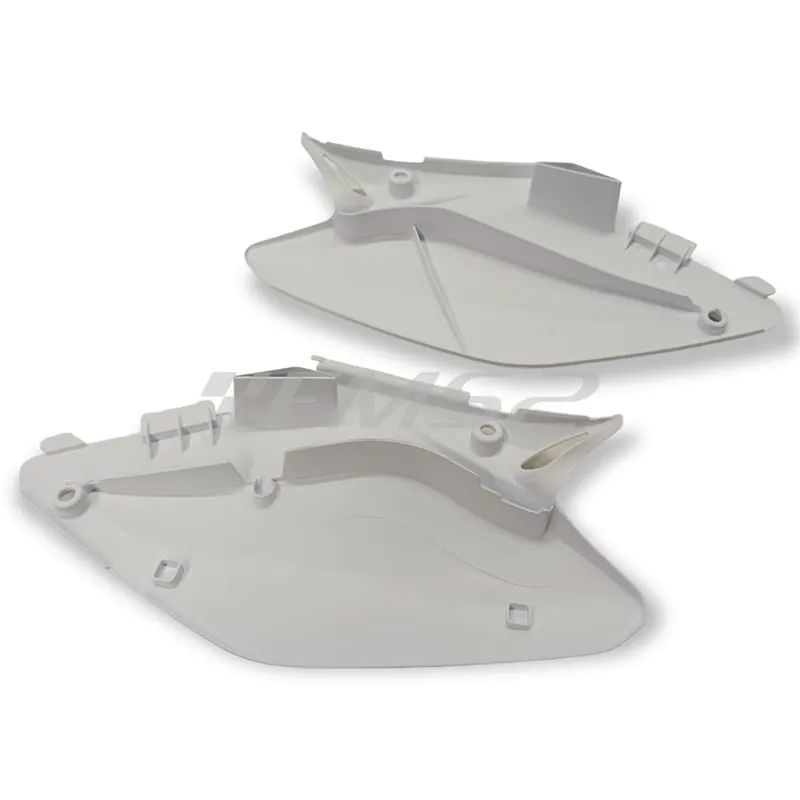 w23207 Coppia fianchetti sotto sella posteriori HM - Vent in plastica di colore bianco senza grafiche per HM e Vent 50 cc e 125 cc enduro e motard