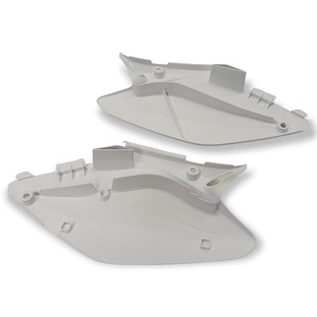 Coppia fianchetti sotto sella posteriori HM - Vent in plastica di colore bianco senza grafiche per HM e Vent 50 cc e 125 cc enduro e motard, ricambio W23207